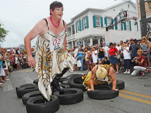Wearing startlingly high heels mandated by race rules, female impersonators attempt to dash down the street faster than their rivals while trying to avoid spills, broken heels and wardrobe malfunctions. 